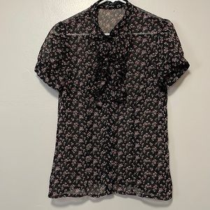 Pretty  sheer black blouse with pink flowers.